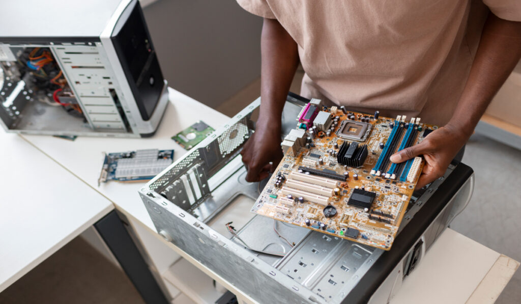 man repairing computer